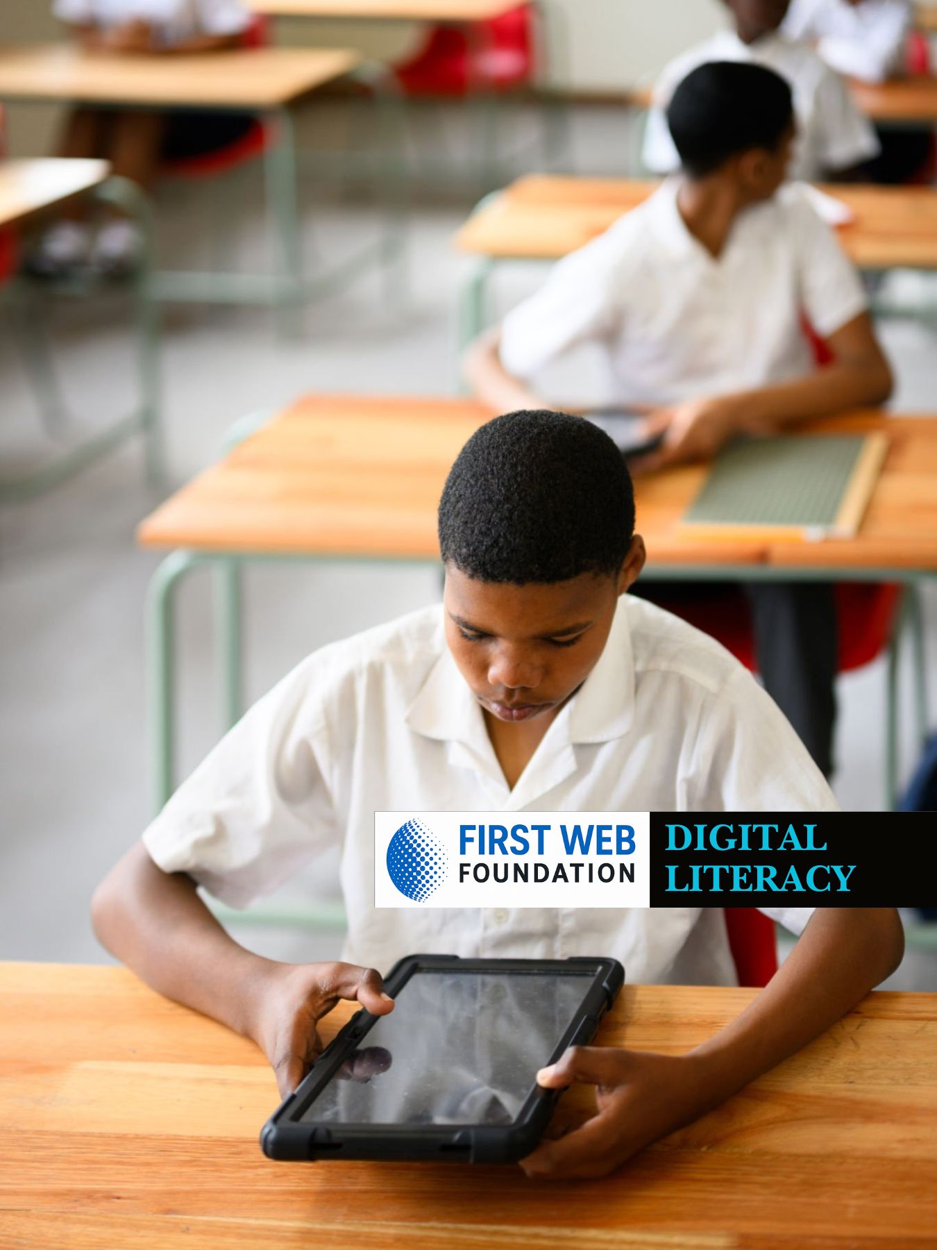 A group of students leveraging digital technology in class, courtesy of the First Web Foundation.